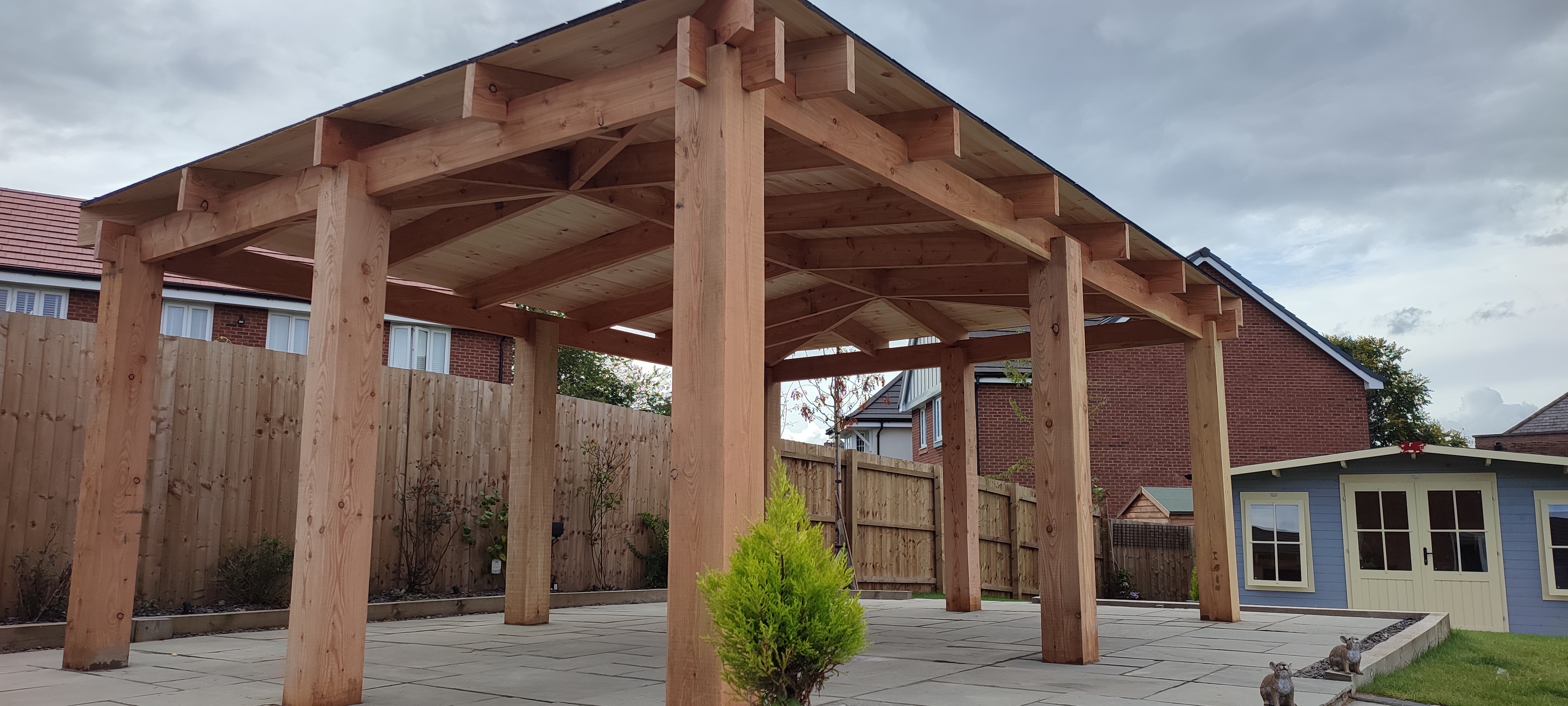 Creating a Stunning Outdoor Area: Stone Decking and Wooden Gazebo Construction